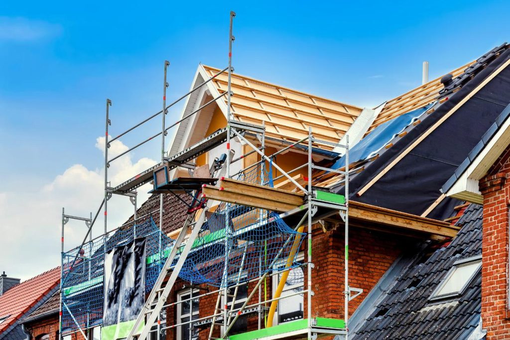 House with scaffolding during roof works