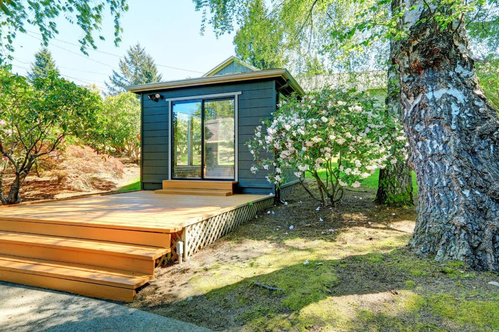 Small garden studio on timber decking